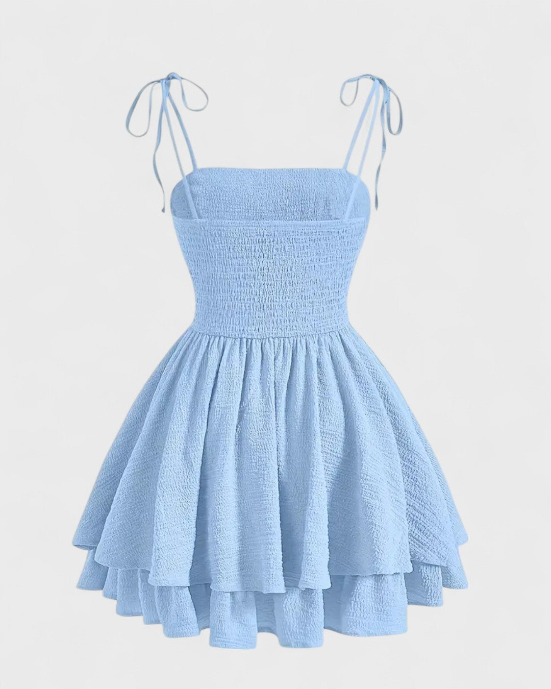 Cléa | Robe courte bleue à bretelles nouées et jupe à volants