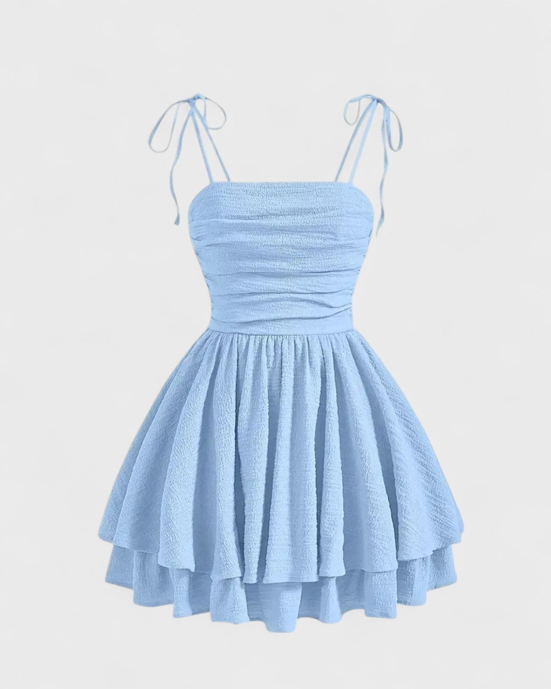 Cléa | Robe courte bleue à bretelles nouées et jupe à volants