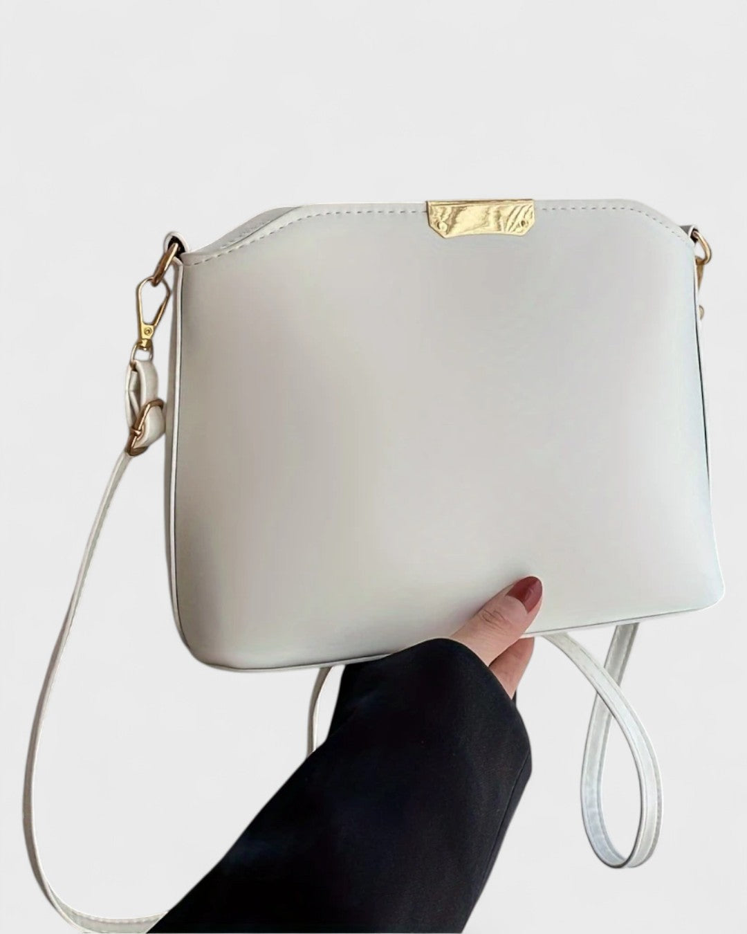 Sac à bandoulière rigide à détail doré