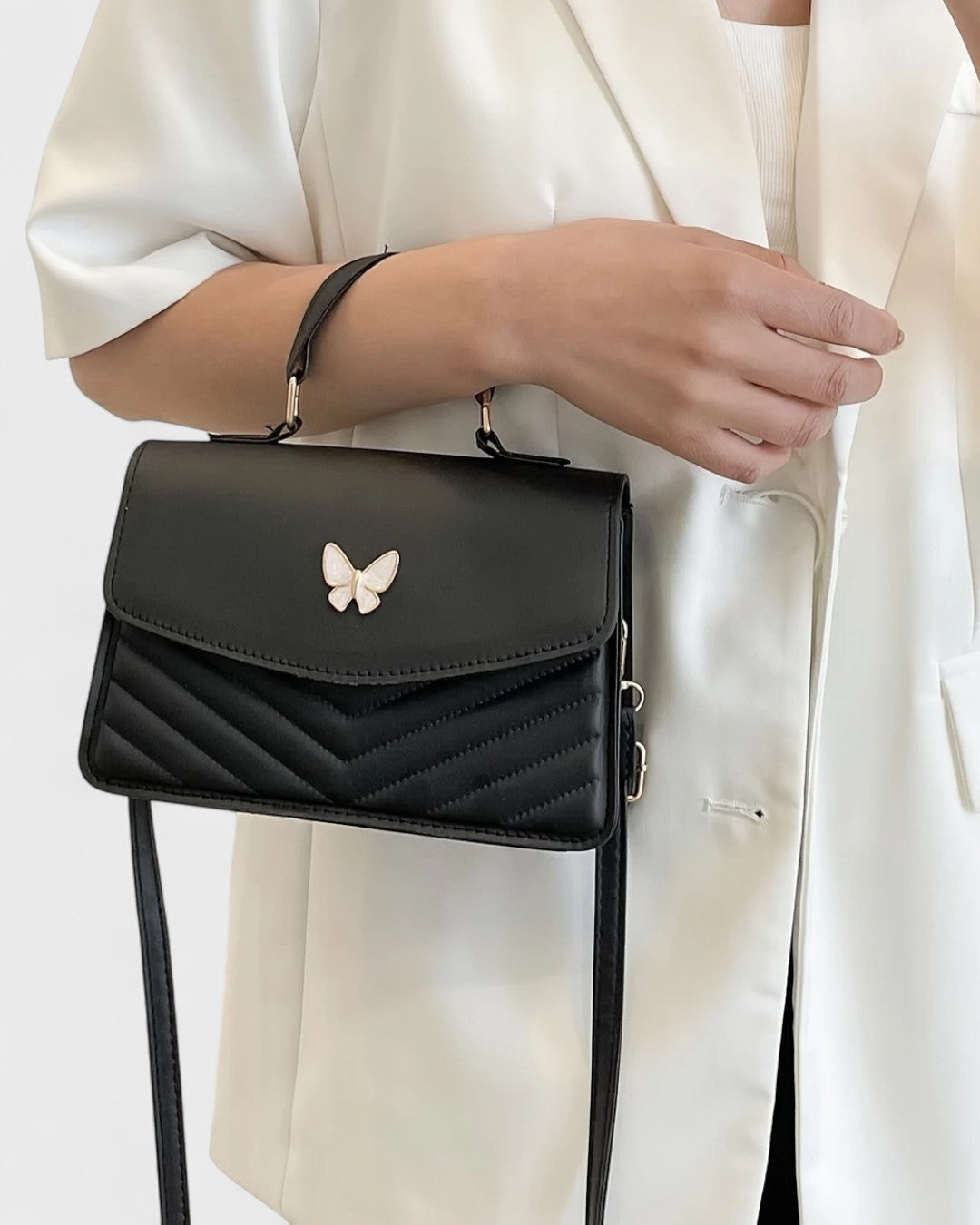 Sac à main papillon en simili cuir matelassé