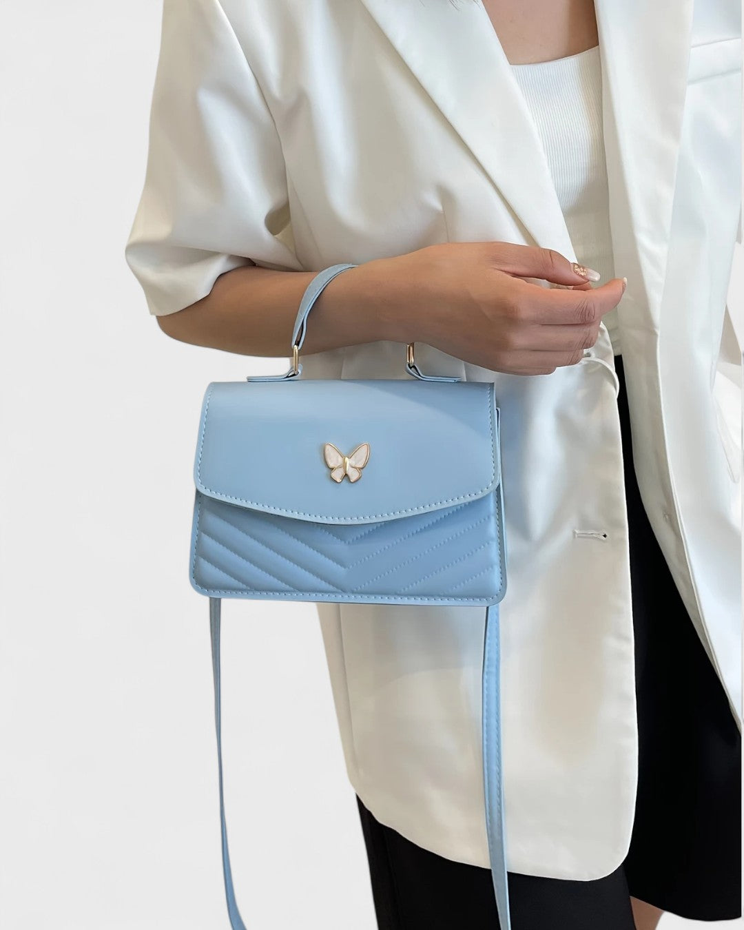 Sac à main papillon en simili cuir matelassé