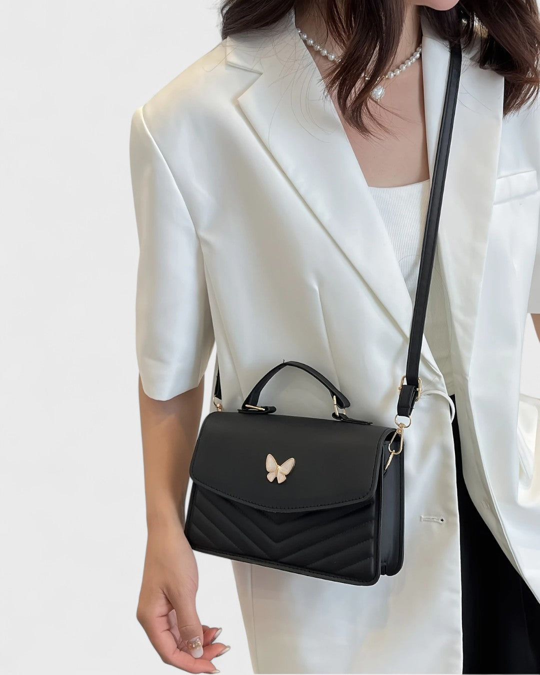 Sac à main papillon en simili cuir matelassé